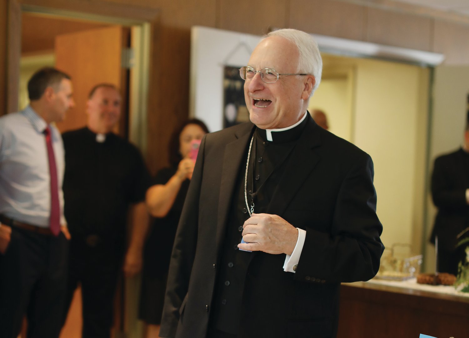 On Sept. 1, Bishop Thomas J. Tobin marked Bishop Robert C. Evans’ 75th birthday by hosting a gathering for cake in his chancery office. During the party, Bishop Tobin offered his birthday wishes and prayers for Bishop Evans, thanking him for his many years of service to the Diocese of Providence.